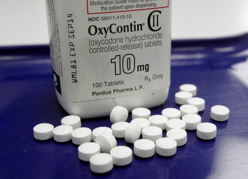 FILE - This Feb. 19, 2013, file photo, shows OxyContin pills arranged for a photo at a pharmacy in Montpelier, Vt. Prescription painkillers should not be a first-choice for treating common ailments like back pain and arthritis, according to new federal guidelines designed to reshape how doctors prescribe drugs like OxyContin and Vicodin. Amid an epidemic of addiction and abuse tied to these powerful opioids drugs, the CDC is urging general doctors to try physical therapy, exercise and over-the-counter pain medications before turning to painkillers for chronic pain. (AP Photo/Toby Talbot, File)