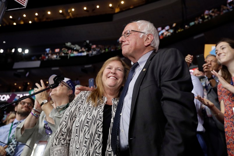 Former Democratic presidential candidate, Sen. Bernie Sanders, I-Vt., hugs wife Jane after standing with the Vermont delegation and asking that Hillary Clinton become the unanimous choice for President of the United States during the second day of the Democratic National Convention in Philadelphia , Tuesday, July 26, 2016. (AP Photo/Matt Rourke)