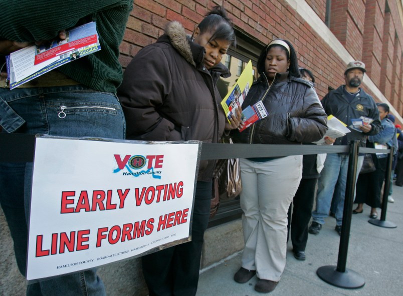 FILE - In this file photo taken Oct. 29, 2008, voters line up outside the Hamilton County Board of Elections for early voting in Cincinnati. U.S. District Judge Michael Watson ruled Tuesday, May 24, 2016, that a law trimming early voting in Ohio is unconstitutional, after the state's Democratic Party and other plaintiffs sued over Republican-backed changes to voting rules in the presidential battleground state. (AP Photo/Al Behrman, File)