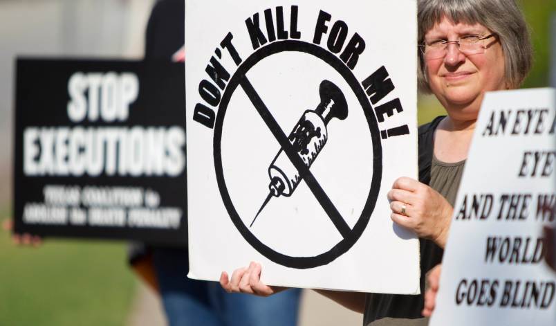 The Reverend Lisa Hunt, the rector of St. Stephen's Episcopal Church, stands with the Texas Coalition to Abolish the Death Penalty to protest the execution of Humberto Leal Thursday, July 7, 2011, outside St. Stephen's Episcopal Church & School in Houston.  ( Nick de la Torre / Houston Chronicle )