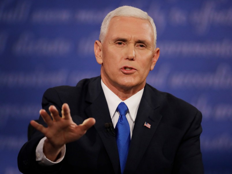 Republican vice-presidential nominee Gov. Mike Pence speaks with Democratic vice-presidential nominee Sen. Tim Kaine during the vice-presidential debate at Longwood University in Farmville, Va., Tuesday, Oct. 4, 2016. (AP Photo/Patrick Semansky)