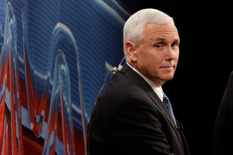 Republican vice-presidential nominee Gov. Mike Pence looks down at the debate floor from a television booth before the start of the third and final presidential debate between Democratic presidential nominee Hillary Clinton Republican presidential nominee Donald Trump in Las Vegas, Wednesday, Oct. 19, 2016. (AP Photo/John Locher)