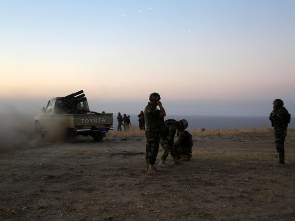 Kurdish security forces take up a position as they fight overlooking the Islamic State-controlled in villages surrounding Mosul, in Khazer, about 30 kilometers (19 miles) east of Mosul, Iraq, Monday, Oct. 17, 2016. Iraqi government and Kurdish forces, backed by U.S.-led coalition air and ground support, launched coordinated military operations early on Monday as the long-awaited fight to wrest the northern city of Mosul from Islamic State fighters got underway.(AP Photo)