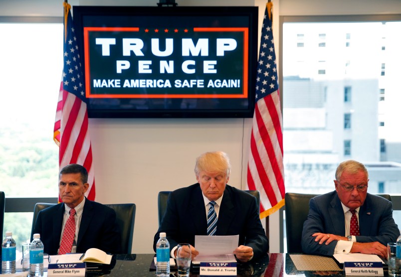 Republican presidential candidate Donald Trump, conducts a roundtable discussion on national security in his offices in Trump Tower in New York, Wednesday, Aug. 17, 2016. Left is Ret. Army Gen. Mike Flynn and right is Ret. Army Lt. Gen. Keith Kellogg. (AP Photo/Gerald Herbert)