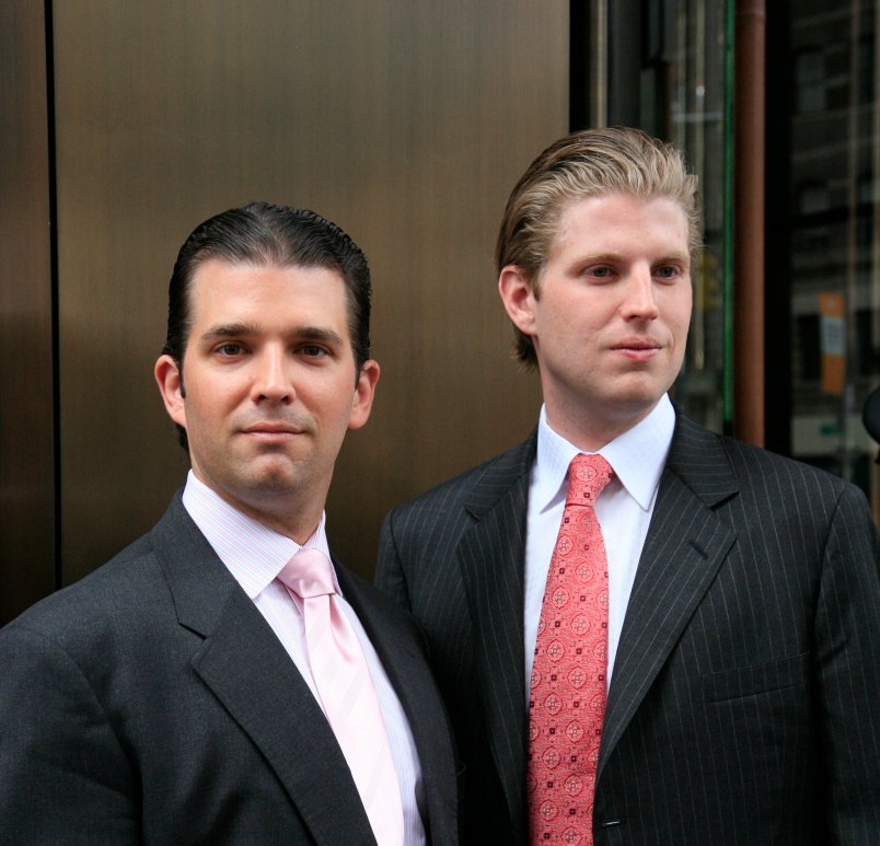 Donald Trump, Jr., left, and his brother Eric pose for photographers after attending the opening of the Trump SoHo New York, Friday, April 9, 2010. The 46 story hotel condominium has 391 units. (AP Photo/Mark Lennihan)