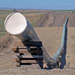 FILE - In this Sept. 29, 2016, file photo, shows a section of the Dakota Access Pipeline under construction  near the town of St. Anthony in Morton County, N.D. Texas-based Energy Transfer Partners, the company building the oil pipeline, asked a a federal judge on Tuesday, Jan. 17, 2017, to block the U.S. Army Corps of Engineers from launching a full environmental study of the $3.8 billion pipeline's disputed crossing of a Missouri River reservoir in North Dakota. (Tom Stromme/The Bismarck Tribune via AP, File)