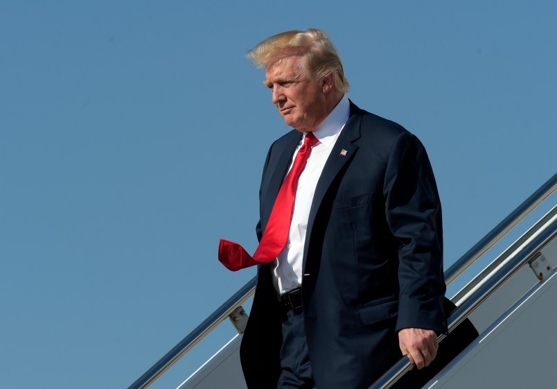 President Donald Trump walks down the steps of Air Force One as he arrives a Palm Beach International Airport in West Palm Beach, Fla., Friday, Feb. 17, 2017. Trump is spending a third weekend in a row at his Mar-a-Lago estate. (AP Photo/Susan Walsh)