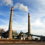 **ADVANCE FOR WEEKEND EDITIONS, DEC. 1-2** Smoke stacks from the NRG power plant located just outside of Jewett, Texas tower over Texas Highway 39, Nov. 28, 2007. The plant provides 250 full-time jobs for Limestone county. Jewett is one of four towns, two in Texas and two in Illinois, competing for the new state-of-the-art FutureGen power plant developers say would emit almost no pollution, turning coal into gas while capturing and storing climate-changing carbon dioxide deep underground. (AP Photo/Nick Simonite)