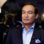 United Airlines CEO Oscar Munoz waits to be interviewed Thursday, June 2, 2016, in New York, during a presentation of the carrier's new Polaris service, a new business class product that will become available on trans-Atlantic flights. (AP Photo/Richard Drew)