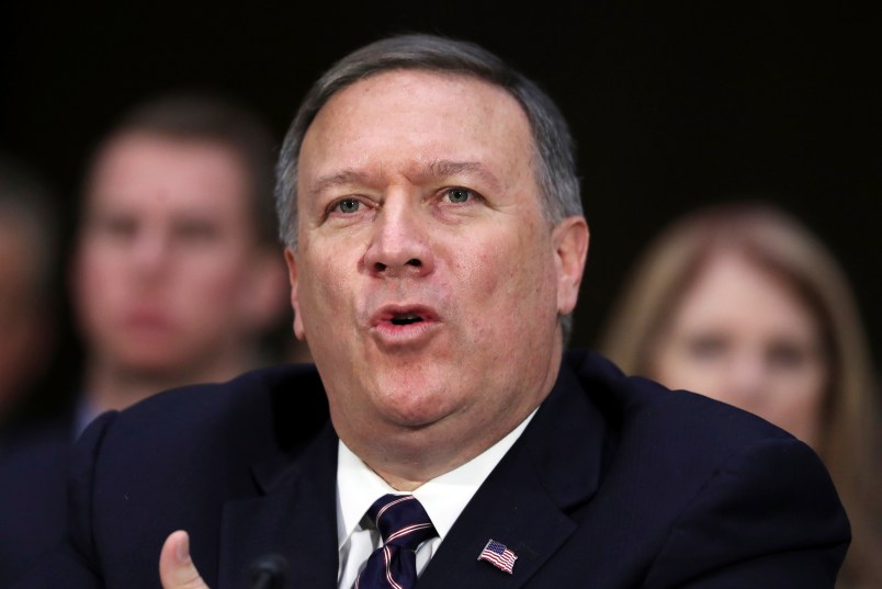 CIA Director-designate Rep. Michael Pompeo, R-Kan. testifies on Capitol Hill in Washington, Thursday, Jan. 12, 2017, at his confirmation hearing before the Senate Intelligence Committee. Seated behind Pompeo is his wife Susan Pompeo, right, and their son Nick, left. (AP Photo/Manuel Balce Ceneta)