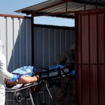 A Turkish expert evacuateS a victim of alleged chemical weapons attacks in Syrian city of Idlib, at a local hospital in Reyhanli, Hatay, Turkey, Tuesday, April 4, 2017. A suspected chemical attack in a town in Syria's rebel-held northern Idlib province killed dozens of people on Tuesday, opposition activists said, describing the attack as among the worst in the country's six-year civil war. (DHA-Depo Photos via AP)