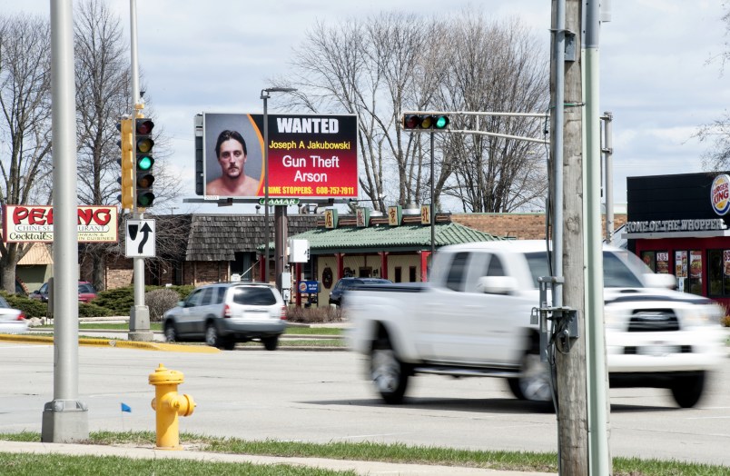 An electronic billboard on Milton Ave. in Janesville, Wis., shows a wanted sign for Joseph Jakubowski as cars drive by Thursday, April 6, 2017.