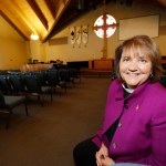 HOLD FOR RACHEL ZOLL STORY--In this Wednesday, April 19, 2017, photograph, Bishop Karen Oliveto is shown in the sanctuary of a United Methodist Church near her office in Highlands Ranch, Colo. Oliveto, who recently moved from San Francisco to Denver to be bishop for the United Methodist Church in a four-state region in the intermountain West, will face a church hearing next Tuesday, April 25, in Newark, N.J. The hearing is to determine whether the election violated church law barring the appointment of "self-avowed practicing homosexuals" since Oliveto is married to a woman.  (AP Photo/David Zalubowski)