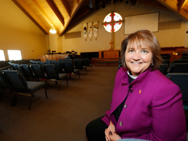 HOLD FOR RACHEL ZOLL STORY--In this Wednesday, April 19, 2017, photograph, Bishop Karen Oliveto is shown in the sanctuary of a United Methodist Church near her office in Highlands Ranch, Colo. Oliveto, who recently moved from San Francisco to Denver to be bishop for the United Methodist Church in a four-state region in the intermountain West, will face a church hearing next Tuesday, April 25, in Newark, N.J. The hearing is to determine whether the election violated church law barring the appointment of "self-avowed practicing homosexuals" since Oliveto is married to a woman.  (AP Photo/David Zalubowski)