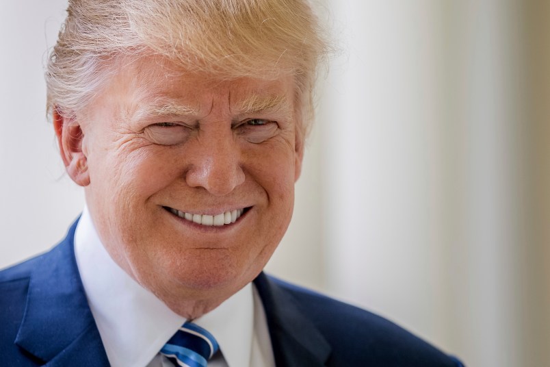 President Donald Trump poses for a photograph on West Wing Colonnade at the White House in Washington, Friday, April 21, 2017.  (AP Photo/Andrew Harnik)
