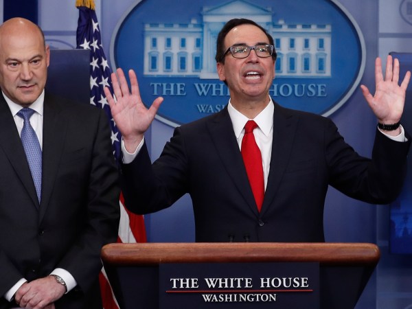 Treasury Secretary Steven Mnuchin, joined by National Economic Director Gary Cohn, speaks in the briefing room of the White House, in Washington, Wednesday, April 26, 2017. President Donald Trump is proposing dramatically reducing the taxes paid by corporations big and small in an overhaul his administration says will spur economic growth and bring jobs and prosperity to the middle class. (AP Photo/Carolyn Kaster)