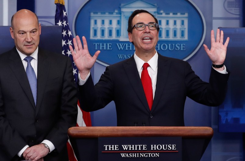 Treasury Secretary Steven Mnuchin, joined by National Economic Director Gary Cohn, speaks in the briefing room of the White House, in Washington, Wednesday, April 26, 2017. President Donald Trump is proposing dramatically reducing the taxes paid by corporations big and small in an overhaul his administration says will spur economic growth and bring jobs and prosperity to the middle class. (AP Photo/Carolyn Kaster)