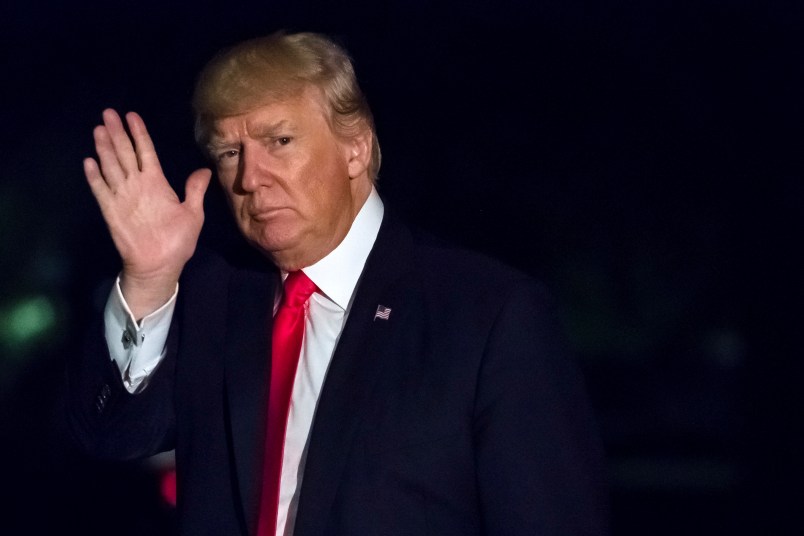 President Donald Trump waves as he walks across the south lawn of the White House in Washington late Saturday night, April 29, 2017 on this return from a rally in Harrisburg, PA. (AP Photo/J. David Ake)