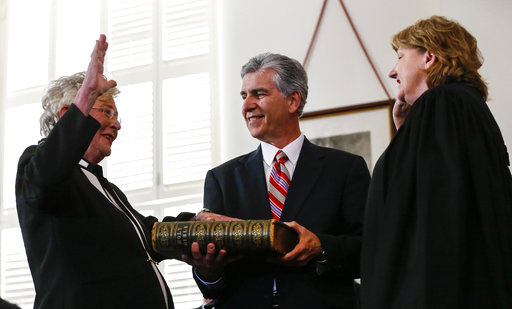 Kay Ivey (left) takes the oath of office as Governor of Alabama as she is sworn in by Acting Chief Justice, Lyn Stuart, Monday, April 10, 2017, in Montgomery, Ala. (AP Photo/Butch Dill)