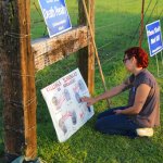 4/24/17Arkansas Democrat-Gazette/STEPHEN B. THORNTONNGina Grimm, daughter of executed inmate Jack Jones, touches a poster of those condemned to be executed in their taped off “protest corral” outside the Varner Unit shortly after 7 pm Monday evening April 24, 2017 near Varner, Ark.