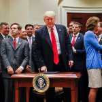 President Donald Trump, center, surrounded by Congressional and business leaders, gets up from his seat after signing an Executive Order in the Roosevelt Room of the White House in Washington, Friday, April 28, 2017. The Executive Order directs the Interior Department to begin review of restrictive drilling policies for the outer-continental shelf. (AP Photo/Pablo Martinez Monsivais)