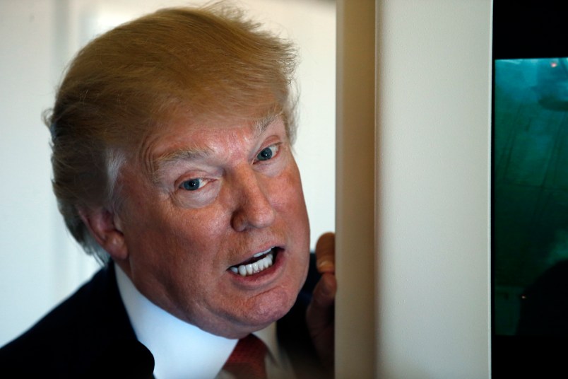 President Donald Trump speaks with reporters on Air Force One while in flight from Andrews Air Force Base, Md., to Palm Beach International Airport, Fla., Thursday, April 6, 2017. (AP Photo/Alex Brandon)