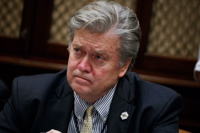 White House chief strategist Steve Bannon listens as President Donald Trump speaks during a meeting with county sheriffs in the Roosevelt Room of the White House in Washington, Tuesday, Feb. 7, 2017. (AP Photo/Evan Vucci)