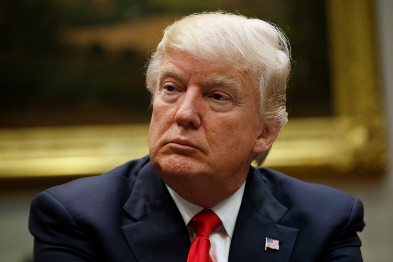 President Donald Trump listens during a meeting with the National Association of Manufacturers in the Roosevelt Room of the White House, Friday, March 31, 2017, in Washington. (AP Photo/Evan Vucci)