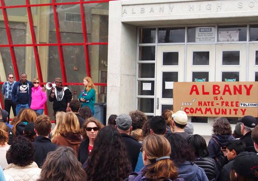 In this March 26, 2017 photo, more than 300 people attended the Albany for All rally at Albany High School to support unity and inclusiveness in response to racistand offensive posted on social media in Albany, Calif. Racist Instagram posts that included nooses around the necks of minority students at a San Francisco Bay Area high school prompted outrage and led to the suspension of the student who owned the social media account. But a federal lawsuit says the district went too far when it disciplined students who "liked" or commented on the posts. (Chris Treadway/Bay Area News Group via AP)
