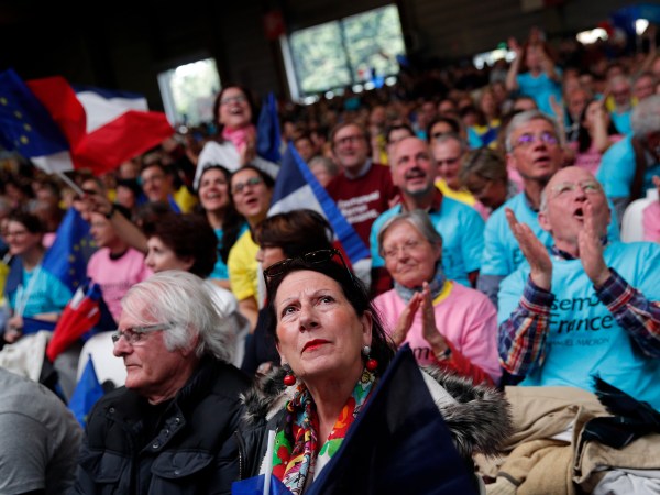 Supporters of French independent centrist presidential candidate Emmanuel Macron attends a campaign rally in Paris, France, Monday, May 1st, 2017. With just six days until a French presidential vote that could define Europe's future, far-right leader Marine Le Pen and centrist Emmanuel Macron are holding high-stakes rallies Monday. (AP Photo/Christophe Ena)