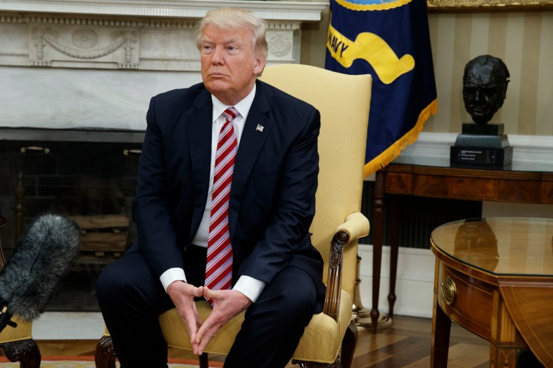 President Donald Trump pauses after speaking to reporters during a meeting with former Secretary of State Henry Kissinger in the Oval Office of the White House, Wednesday, May 10, 2017, in Washington. (AP Photo/Evan Vucci)
