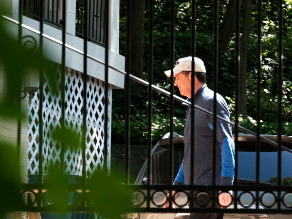 Former FBI Director James Comey walks at his home in McLean, Va., Wednesday, May 10, 2017. President Donald Trump fired Comey on Tuesday, ousting the nation's top law enforcement official in the midst of an investigation into whether Trump's campaign had ties to Russia's election meddling. (AP Photo/Sait Serkan Gurbuz)