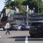 Police investigate a deadly stabbing on a MAX train in Northeast Portland, Ore., Friday, May 26, 2017. (Jim Ryan/The Oregonian via AP)