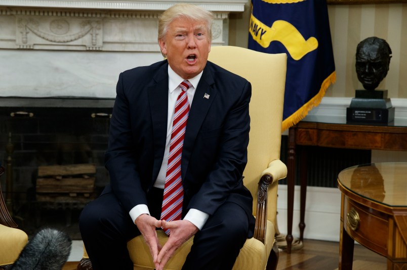 President Donald Trump talks to reporters during a meeting with former Secretary of State Henry Kissinger in the Oval Office of the White House, Wednesday, May 10, 2017, in Washington. (AP Photo/Evan Vucci)