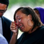 Kimberly Pierson, mother of Alton Sterling's son Na'Quincy Pierson, cries as she speaks to reporters following a meeting with the U.S. Justice Department at federal court in Baton Rouge, La., Wednesday, May 3, 2017, The Justice Department, has decided not to charge two white Baton Rouge police officers in the death of Sterling, whose death was captured on cell phone video, fueling protests in Louisiana's capital and beyond. (AP Photo/Gerald Herbert)