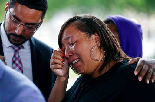 Kimberly Pierson, mother of Alton Sterling's son Na'Quincy Pierson, cries as she speaks to reporters following a meeting with the U.S. Justice Department at federal court in Baton Rouge, La., Wednesday, May 3, 2017, The Justice Department, has decided not to charge two white Baton Rouge police officers in the death of Sterling, whose death was captured on cell phone video, fueling protests in Louisiana's capital and beyond. (AP Photo/Gerald Herbert)