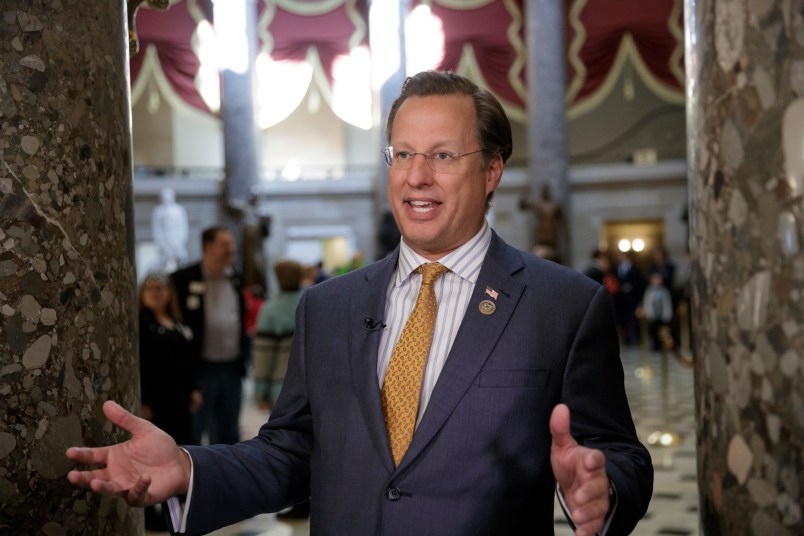 Rep. Dave Brat, R-Va.,  a member of the conservative Freedom Caucus, explains his position to a TV interviewer before his group meets with President Donald Trump as the GOP's long-promised legislation to repeal and replace "Obamacare" moves to a showdown vote, at the Capitol in Washington, Thursday, March 23, 2017. (AP Photo/J. Scott Applewhite)