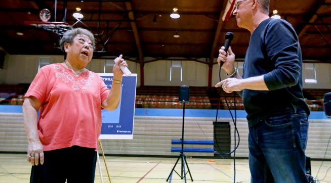 Rae Seaton, of Dubuque, Iowa, challenges U.S. Rep. Rod Blum, R-Iowa, on his answer to her healthcare question during a town hall in the Nora Gymnasium at Dubuque Senior High School in Dubuque, Iowa, on Monday, May 8, 2017.