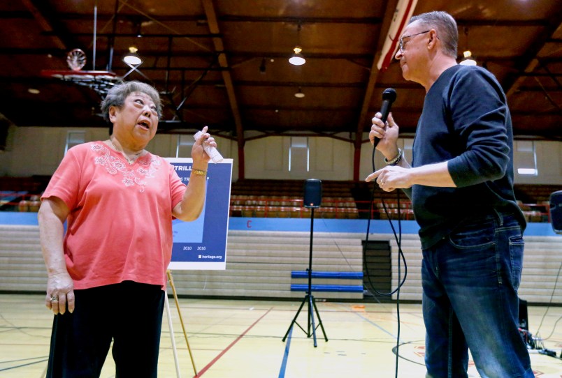 Rae Seaton, of Dubuque, Iowa, challenges U.S. Rep. Rod Blum, R-Iowa, on his answer to her healthcare question during a town hall in the Nora Gymnasium at Dubuque Senior High School in Dubuque, Iowa, on Monday, May 8, 2017.