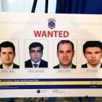 Pictures of people facing criminal charges are seen after a news conference about an altercation outside the Turkish Embassy in Washington during the visit of the Turkish President, Thursday, June 15, 2017, in Washington. Police say they've issued arrest warrants for a dozen Turkish security agents and two others accused of taking part in a violent altercation May 16 as Turkey's president visited Washington. (AP Photo/Alex Brandon)