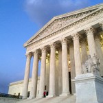 People stand on the steps of the Supreme Court at sunset on Saturday, Feb. 13, 2016, in Washington. On Saturday, Feb. 13, 2016, the U.S. Marshals Service confirmed that Scalia has died at the age of 79. (AP Photo/Jon Elswick)