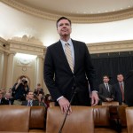 FBI Director James Comey arrives to testify as the House Permanent Select Committee on Intelligence holds first public hearing on allegations of Russian interference in the 2016 U.S. presidential election, and the murky web of contacts between President Donald Trump's campaign and Russia, on Capitol Hill in Washington, Monday, March 20, 2017. (AP Photo/J. Scott Applewhite)