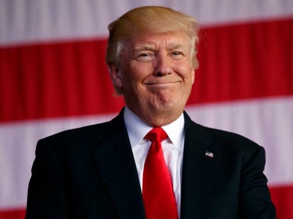 President Donald Trump smiles as he is introduced to speak to U.S. military troops and their families at Naval Air Station Sigonella, Saturday, May 27, 2017, in Sigonella, Italy. (AP Photo/Evan Vucci)