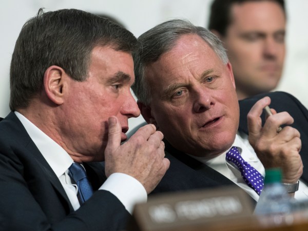 Senate Intelligence Committee Vice Chairman Mark Warner, D-Va., left, confers with Sen. Richard Burr, R-N.C., chairman of the Intelligence Committee as the panel questions top national security chiefs about the  gathering of intelligence on foreign agents, on Capitol Hill in Washington, Wednesday, June 7, 2017. (AP Photo/J. Scott Applewhite)