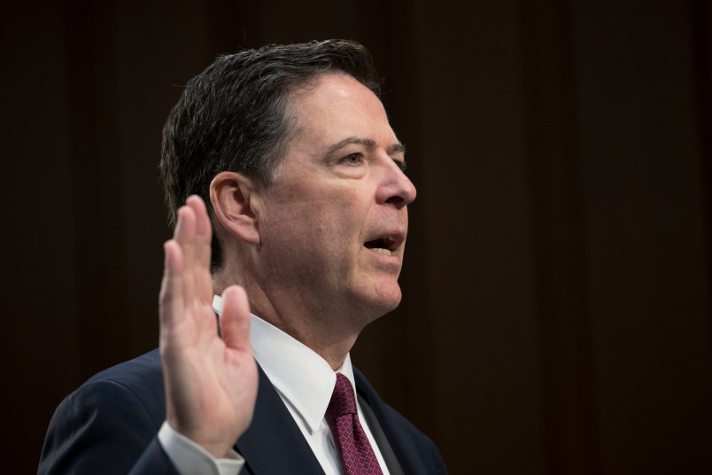 Fired FBI director James Comey is sworn in as he prepares to testify about a series of conversations with President Donald Trump, before the Senate Select Committee on Intelligence on Capitol Hill in Washington, Thursday, June 8, 2017. Comey alleges Trump repeatedly pressed him for his "loyalty" and directly pushed him to "lift the cloud" of investigation by declaring publicly the president was not the target of the probe into his campaign's Russia ties.   (AP Photo/J. Scott Applewhite)