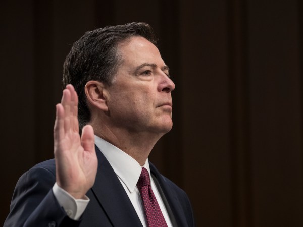 Fired FBI director James Comey is sworn in as he prepares to testify about a series of conversations with President Donald Trump, before the Senate Select Committee on Intelligence on Capitol Hill in Washington, Thursday, June 8, 2017. Comey alleges Trump repeatedly pressed him for his "loyalty" and directly pushed him to "lift the cloud" of investigation by declaring publicly the president was not the target of the probe into his campaign's Russia ties.   (AP Photo/J. Scott Applewhite)