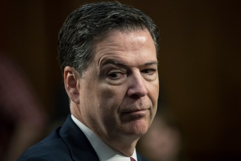 Fired FBI director James Comey recounts a series of conversations with President Donald Trump as he testifies before the Senate Select Committee on Intelligence, on Capitol Hill in Washington, Thursday, June 8, 2017. Comey alleges Trump repeatedly pressed him for his "loyalty" and directly pushed him to "lift the cloud" of investigation by declaring publicly the president was not the target of the probe into his campaign's Russia ties.   (AP Photo/J. Scott Applewhite)