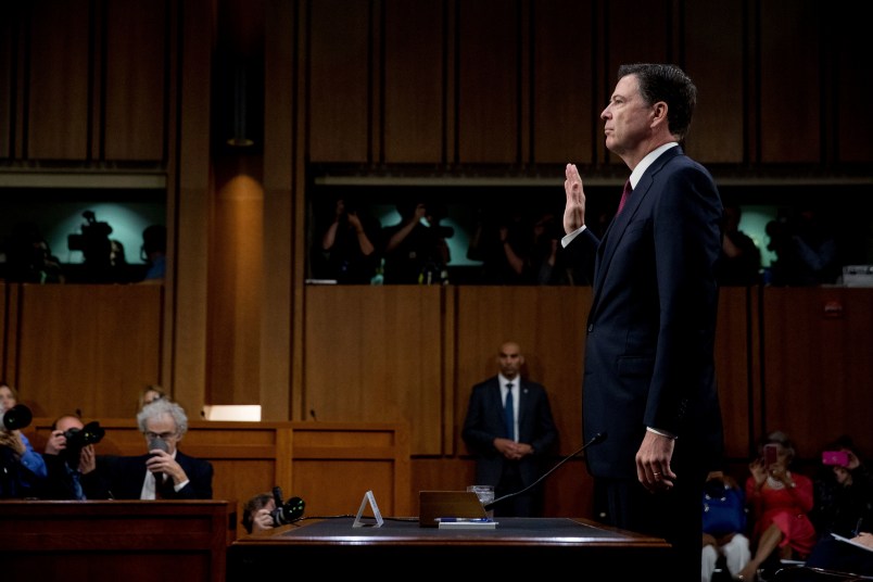 Former FBI Director James Comey is sworn in during a Senate Intelligence Committee hearing on Capitol Hill, Thursday, June 8, 2017, in Washington. (AP Photo/Andrew Harnik)