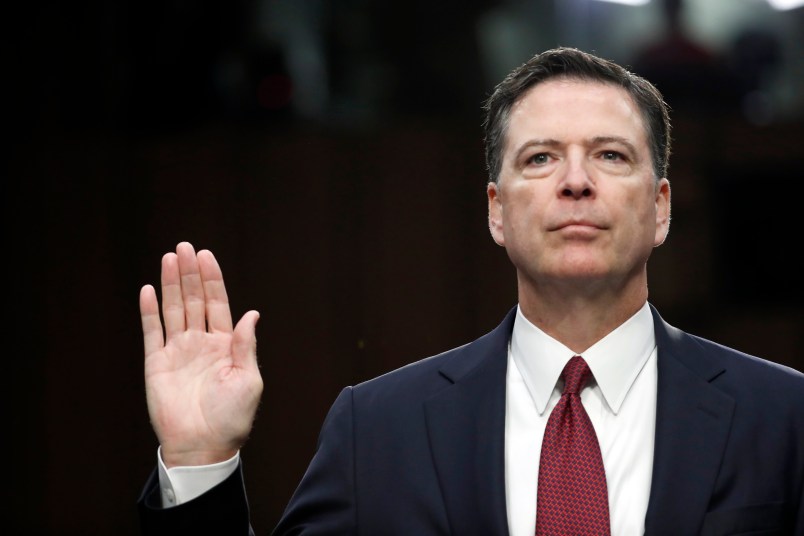 Former FBI Director James Comey is sworn in during a Senate Intelligence Committee hearing on Capitol Hill, Thursday, June 8, 2017, in Washington. (AP Photo/Alex Brandon)