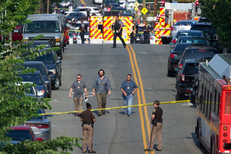 Police and emergency personnel are seen near the scene where House Majority Whip Steve Scalise of La. was shot during a Congressional baseball practice in Alexandria, Va., Wednesday, June 14, 2017.  (AP Photo/Cliff Owen)